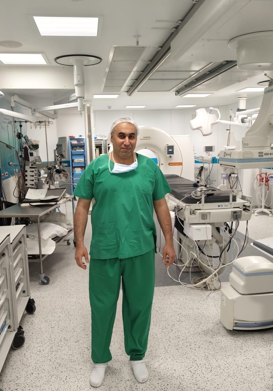 Dr. Abdalla Omira in a modern vascular interventional operating room